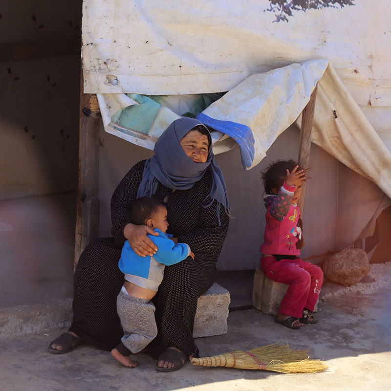 iF Charity - Palestinian woman holding a child